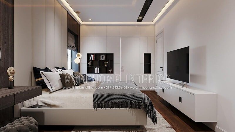 Kệ tivi sơn trắng gỗ công nghiệp ấn tượng với tay nắm âm độc đáo tạo vẻ đẹp sang trọng cho phòng ngủ hiện đại.